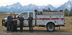 Photo of interagency engine crew with Tetons in background