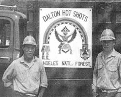 Old photo of Dalton Hotshots standing in front of a truck