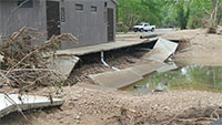 (image) Day use area restroom eroded foundation and roads.