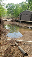 (image) Day use area restroom eroded foundation and roads.