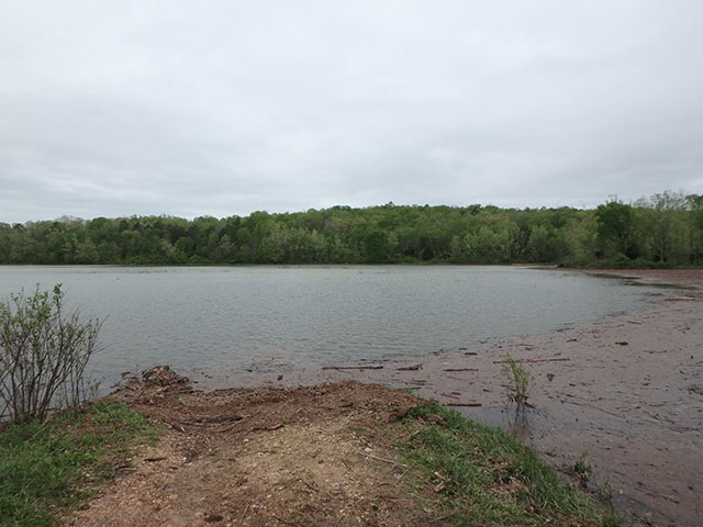 (image) Debris built up along dam and launch site