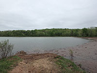(image) Debris built up along dam and launch site