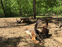 (image) Fire Ring damaged with about 6 inches of rock and dirt depoisted under picnic table.