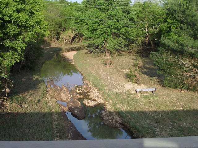 (image) Access road washed out with debris