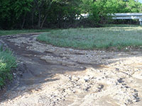 (image) Thomasville access road washed out with debris.