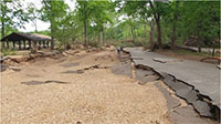 (image) Watercress access road and park area washed out with debris.