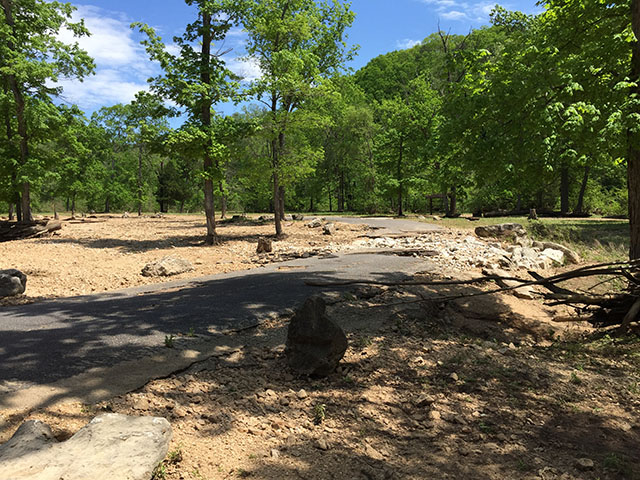 (image)  Road covered with debris and eroded bed