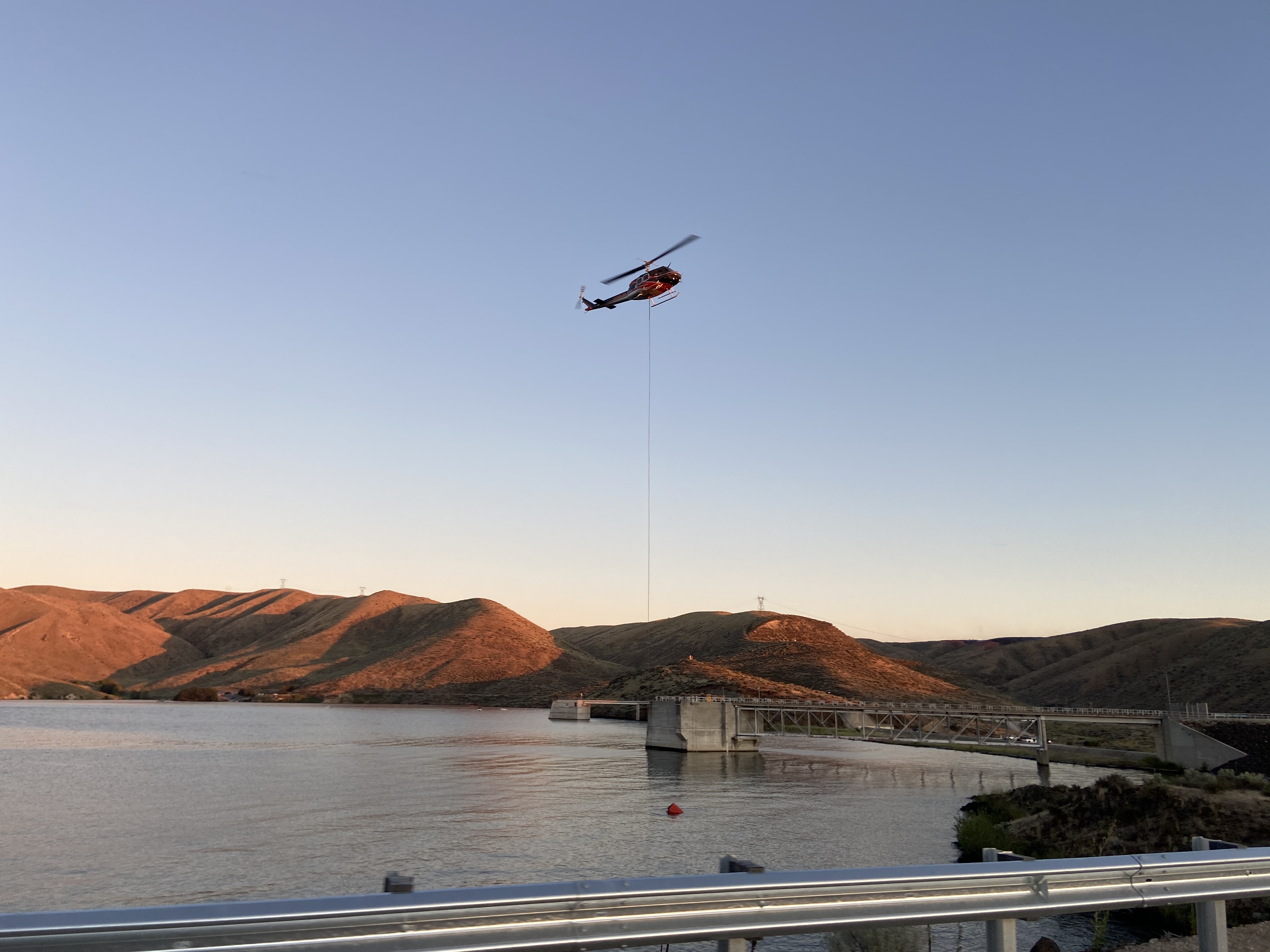 Helicopter dipping out of Lucky Peak Reservoir