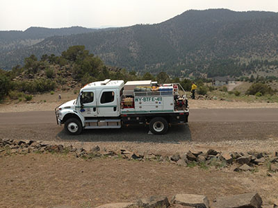 Engine 441 on fire assignment in Colorado overlooking scenic canyon