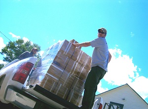 Image showing supplies being loaded onto a truck
