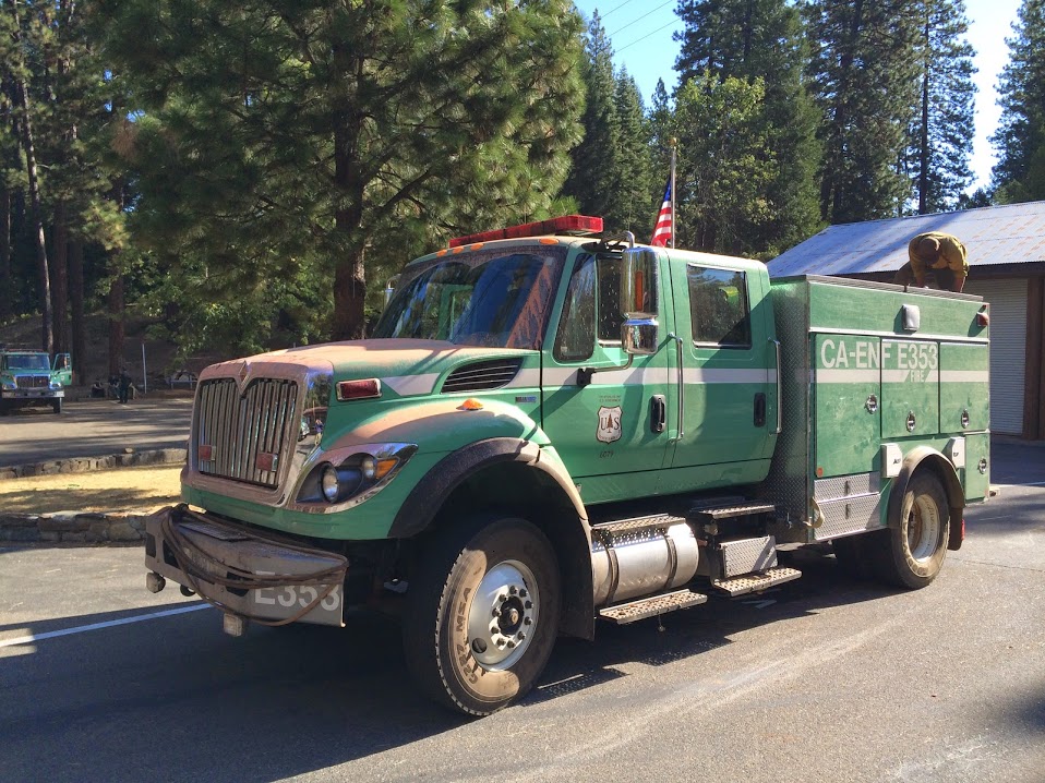 Side view of a green forest service fire engine